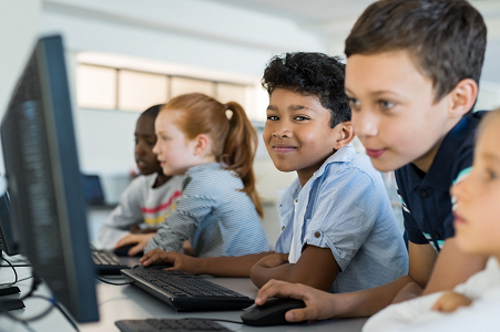 Children using computers in school.