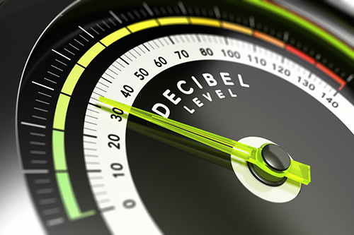 Decibel measurement gauge with green needle pointing to 30 dB
