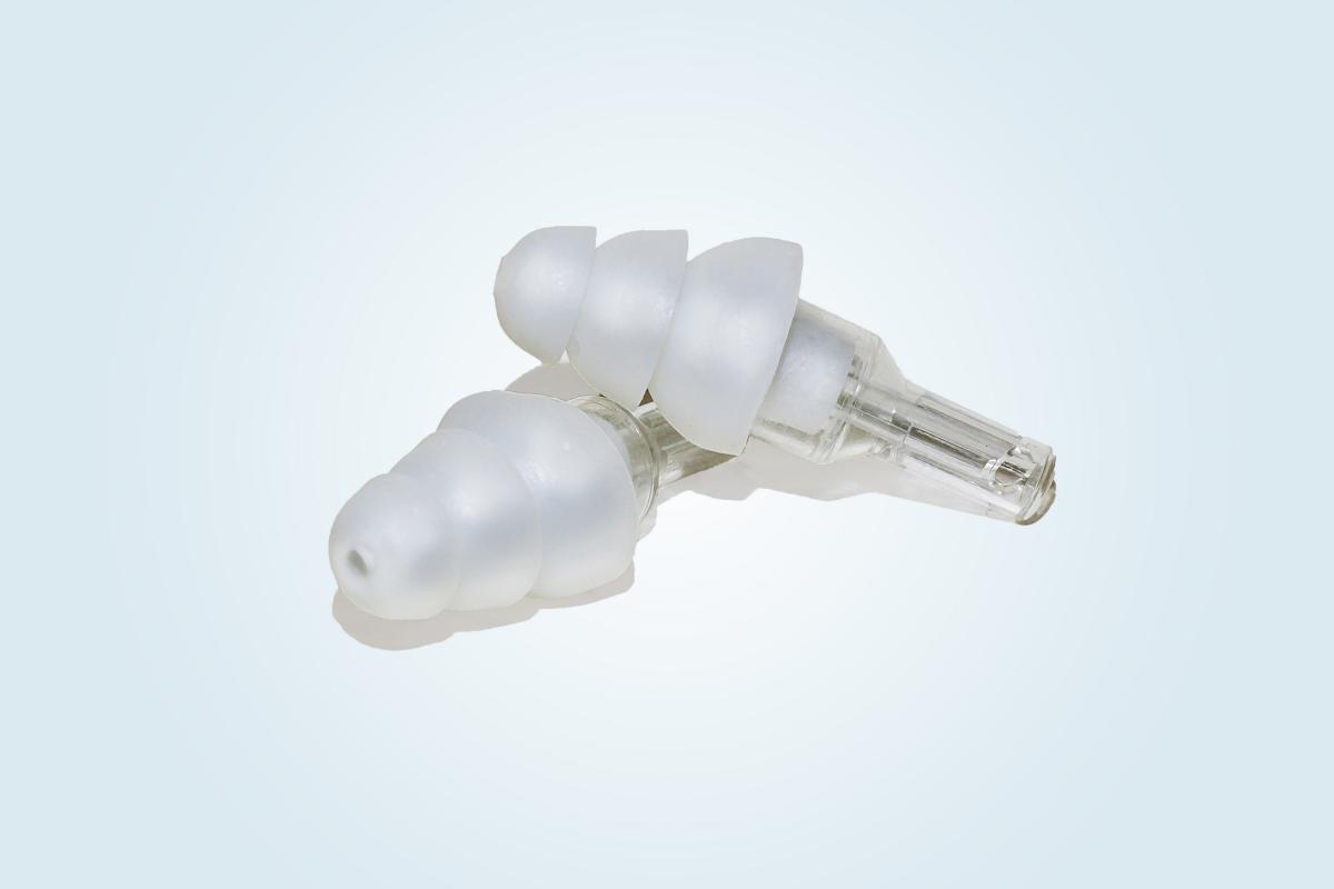 A pair of white high-fidelity earplugs.